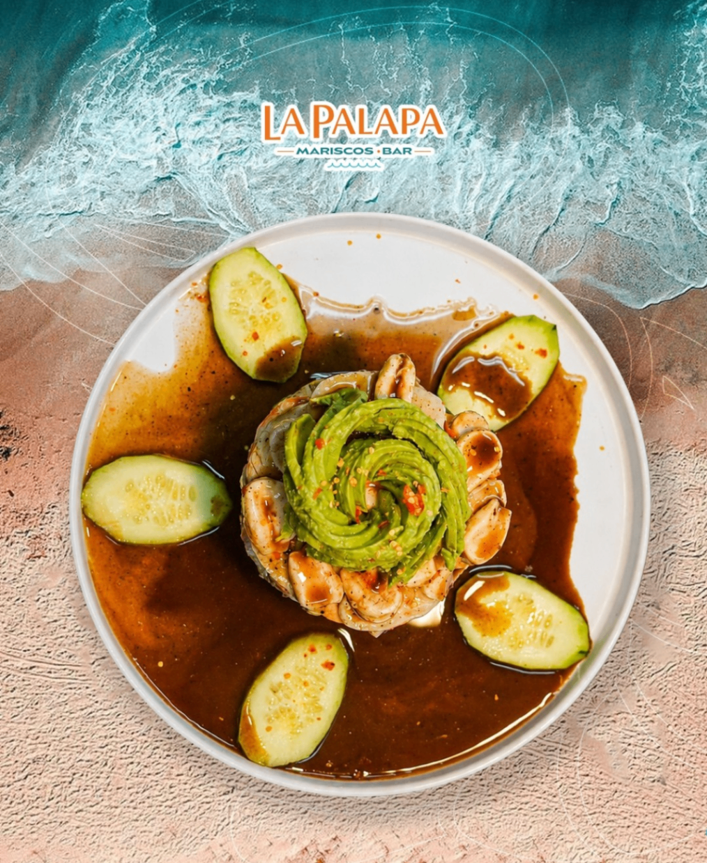 Seafood and avocado tower plated with cucumber.